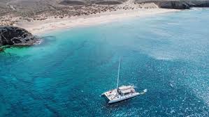 Adults enjoying a catamaran sailing experience